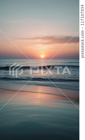 Pastel colors of calm radiant sea waves at sunset. 117107834
