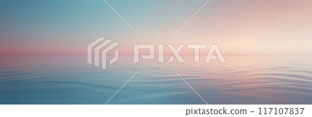 Pastel colors of calm radiant sea waves at sunset. 117107837