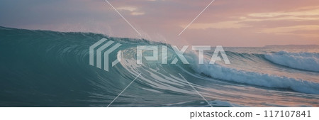 Pastel colors of calm radiant sea waves at sunset. 117107841