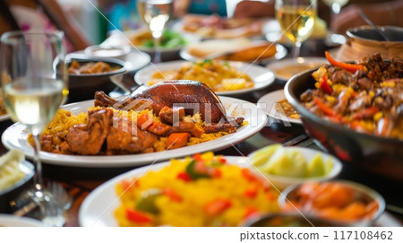 Experience a traditional family-owned restaurant feast featuring communal dining and a spread of flavorful. Ethnic dishes in a cozy Experience a traditional family-owned restaurant feast featuring communal dining and a spread of flavorful. Ethnic dishes in a cozy 117108462