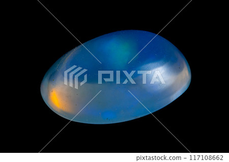 natural rainbow opal gem isolated on black background 117108662
