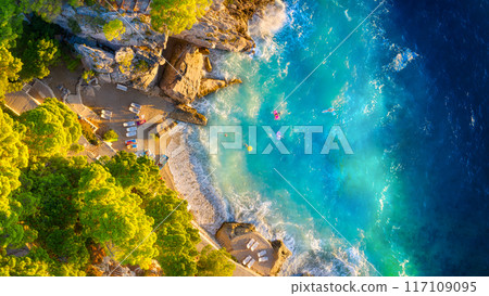 Drone view of the sea coast. Rocky shore and sea water. Vacation and travel. 117109095