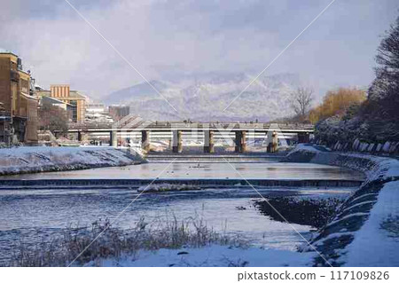 Winter Kyoto Kamo River with Kitayama and Oike Bridge in the background 117109826