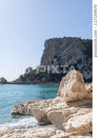 Majestic Limestone Cliffs and Turquoise Waters of Cala Luna Majestic Limestone Cliffs and Turquoise Waters of Cala Luna 117109970