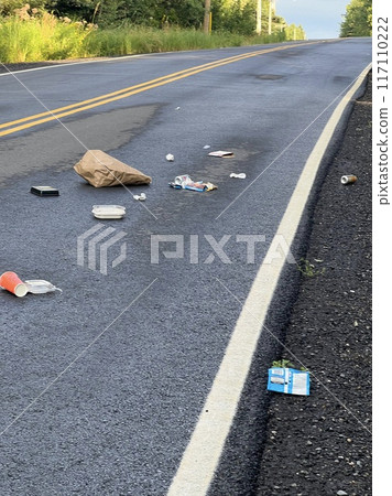 A lot of trash dumped on the road 117110222