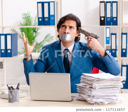 Young male employee with tape on the mouth 117111657