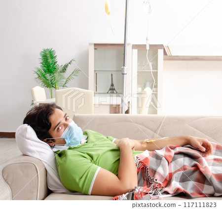 Young man suffering at home 117111823