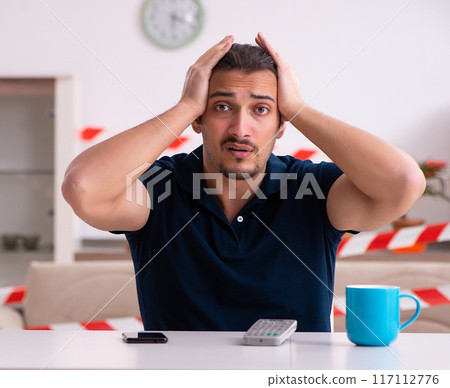 Young man at home in self-isolation concept 117112776