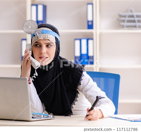 Young doctor in hijab working in the clinic Young doctor in hijab working in the clinic 117112786