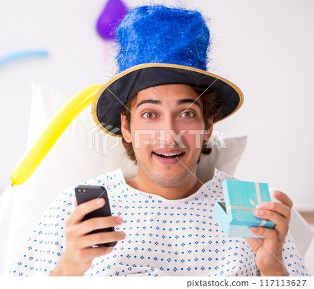 Young man celebrating his birthday in hospital Young man celebrating his birthday in hospital 117113627