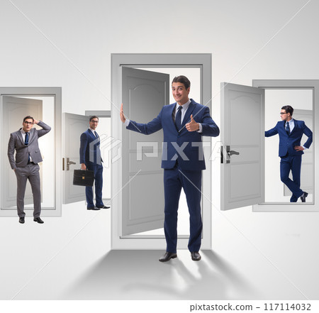 Businessman in uncertainty concept with many doors 117114032