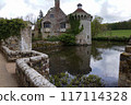 Scotney Castle in Kent England with moat and surrounded by farmland 117114328