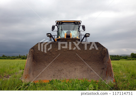 large mechanical excavator backhoe construction yellow equipment vehicle front view 117114751
