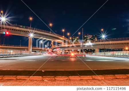 Glittering night view of a highway junction Glittering night view of a highway junction 117115496