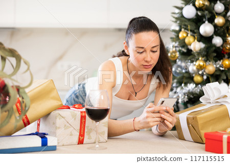 girl on christmas eve communicates talks on phone girl on christmas eve communicates talks on phone 117115515