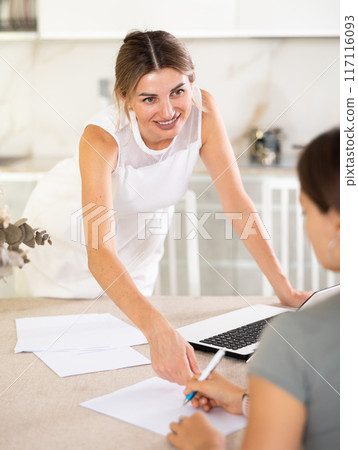 Girl meeting financial advisor for investment at his home 117116093
