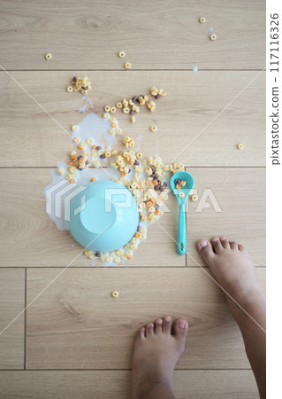 Spilled breakfast cereal on floor 117116326