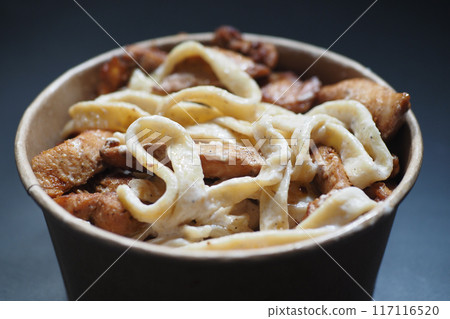 Enjoy a delicious Chicken Alfredo Pasta in a convenient ToGo Bowl for a satisfying meal on the go 117116520