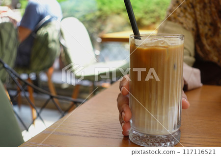 iced late in a transparent glass on cafe table  117116521