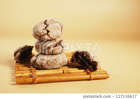 chocolate sweet cookies on orange color background chocolate sweet cookies on orange color background 117116617
