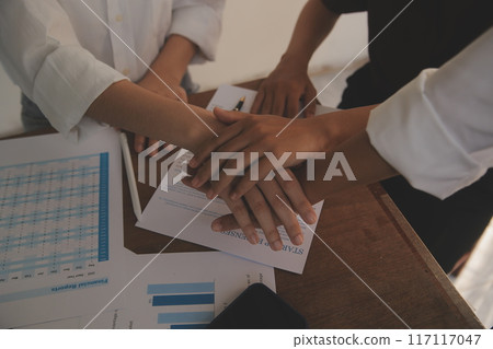 Leaders of business organizations join hands after the meeting is complete. Business partner meeting ideas. Leaders of business organizations join hands after the meeting is complete. Business partner meeting ideas. 117117047