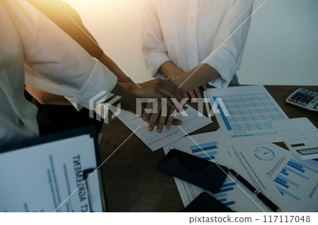Leaders of business organizations join hands after the meeting is complete. Business partner meeting ideas. Leaders of business organizations join hands after the meeting is complete. Business partner meeting ideas. 117117048
