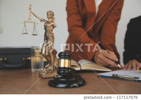 Lawyer, legal advisor, businessman brainstorming information on agreement details Business contracts in legal processing books for accuracy in contract documents. joint financial investment. 117117076