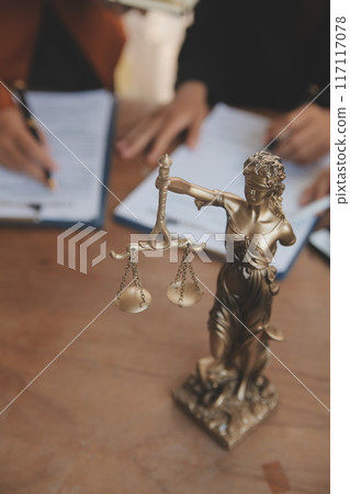 Lawyer, legal advisor, businessman brainstorming information on agreement details Business contracts in legal processing books for accuracy in contract documents. joint financial investment. 117117078