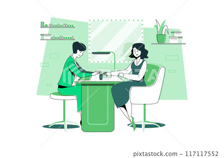 Woman in a nail salon receiving manicure by beauticians. 117117552