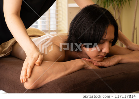 Men's beauty salon body care treatment 117117814