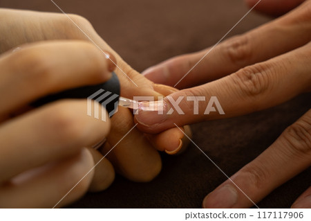 Men's nail treatment 117117906