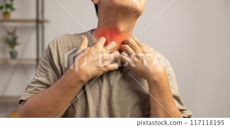 Senior man itchy and scratching arm and legs because dry skin. 117118195