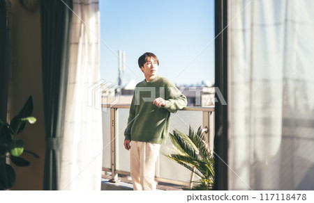 Outdoor men's portrait on the veranda Outdoor men's portrait on the veranda 117118478