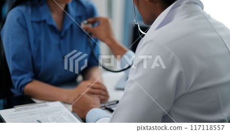 Doctor using a stethoscope checking patient with examining, presenting results symptom and recommend treatment method, Healthcare and medical concept. 117118557
