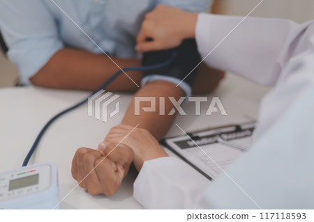 The doctor woman hand use the pulse meter to measure the pressure of the patient, medical checkup concept. 117118593