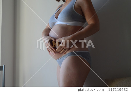 Pregnant woman expecting a baby boy Pregnant woman expecting a baby boy 117119482