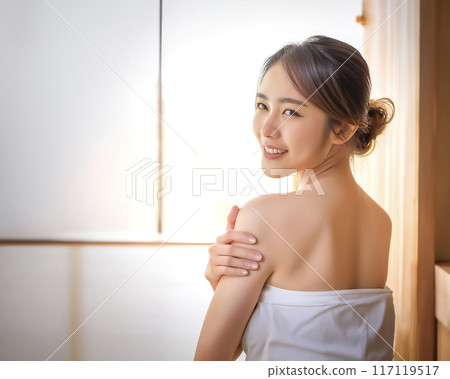 Image of a young woman enjoying a sauna Image of a young woman enjoying a sauna 117119517