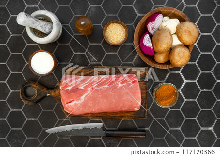 Overhead view of raw pork fillet ready for cooking 117120366