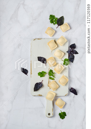 Overhead view of raw uncooked ravioli 117120369