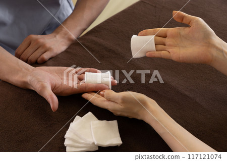 A chiropractor undergoing training in hand care 117121074