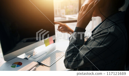 Call center, computer and business with woman in office for customer service, technical support and advice. Technology, contact us and communication with employee operator in help desk agency 117121689