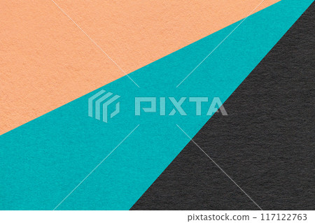 Texture old craft coral, turquoise and black paper background, macro. Vintage abstract cerulean and peach cardboard 117122763