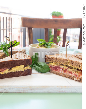 Rye bread sandwich with italian ham and avocado cashew spread Rye bread sandwich with italian ham and avocado cashew spread 117124025
