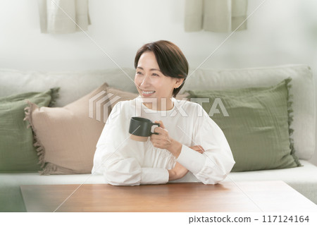 A woman drinking tea leisurely 117124164