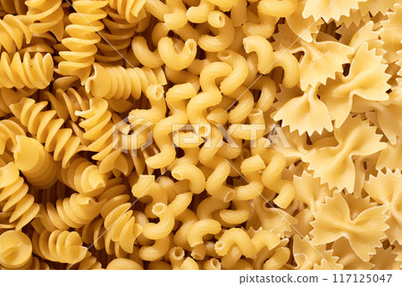 Pasta raw closeup background. Textured variety shapes. Top view 117125047