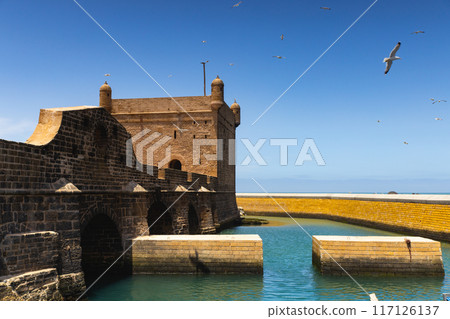 Fortress, bridge and little harbor of Essaouira, Morocco Fortress, bridge and little harbor of Essaouira, Morocco 117126137