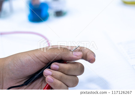 Electroplating experiment in chemistry laboratory. Electroplating experiment in chemistry laboratory. 117126267