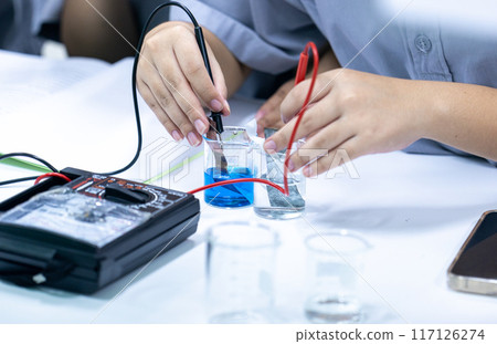 Electroplating experiment in chemistry laboratory. 117126274