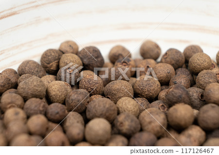 Macro photography of black peppercorns, hot spice Macro photography of black peppercorns, hot spice 117126467