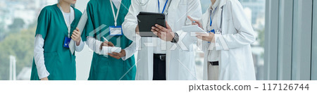 Doctors Cooperating Together In Office 117126744